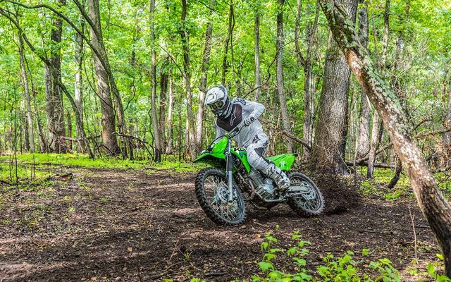 2027 Kawasaki KLX230R S, riding photo